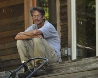 Bill Sparks sitting on the steps of Singletree